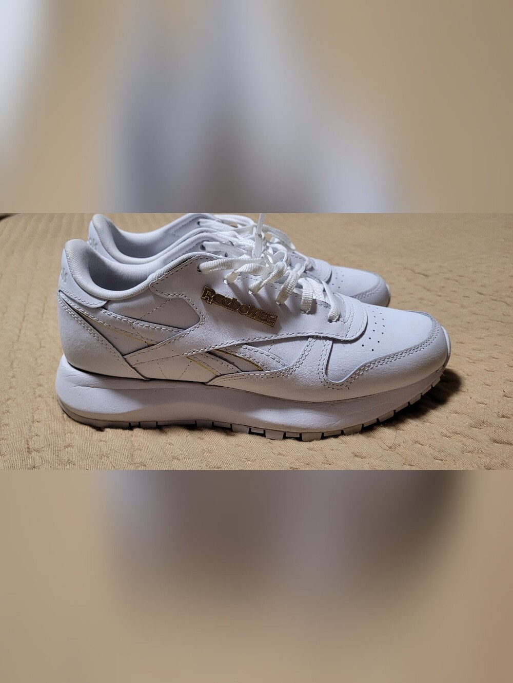 Reebok White Leather Sneakers with Gold Logo
